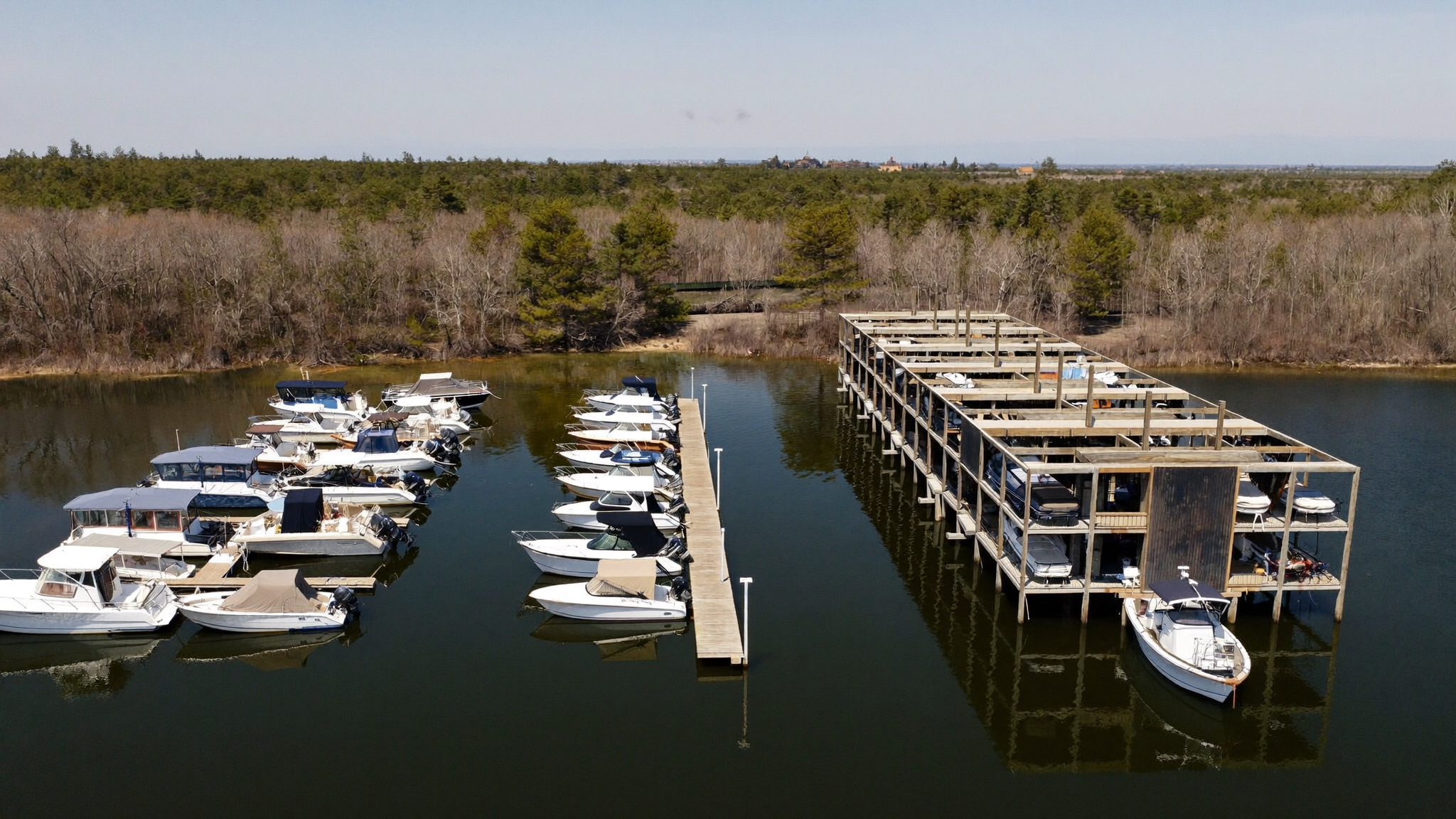 Marina on Lake Moultrie showing covered wet slips and a dry stack boat storage rack